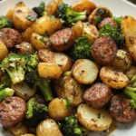 A hearty Roasted Sausage, Potatoes, and Broccoli Skillet with golden potatoes, seared sausage slices, and crispy roasted broccoli.